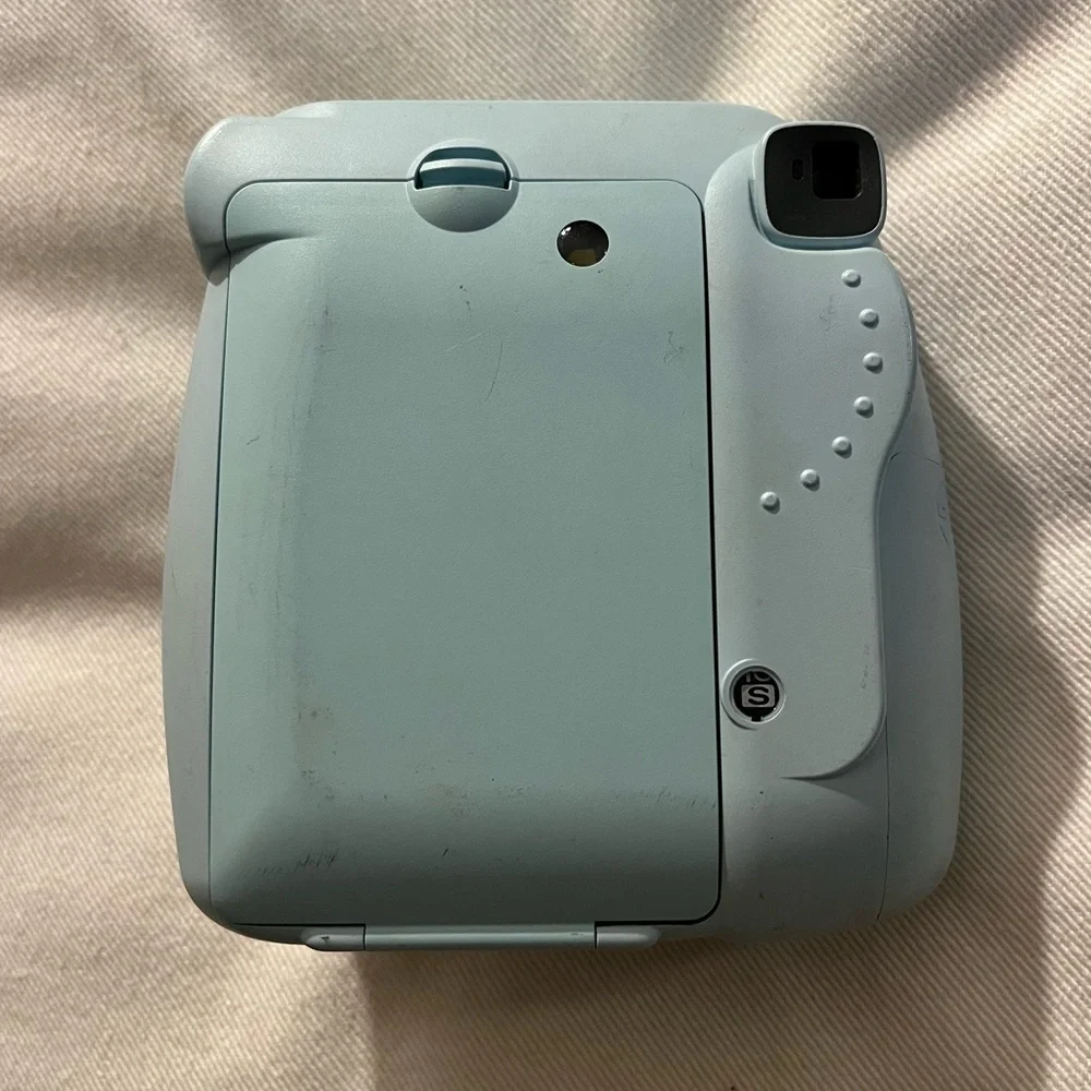 Polaroid camera: Fujifilm, Instax Mini 8. Light blue color, lightly used